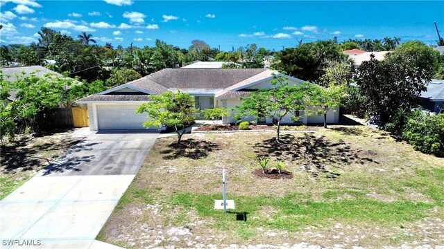 844 106th Ave N, Naples, FL 34108 - ranch-style home featuring a garage and concrete driveway