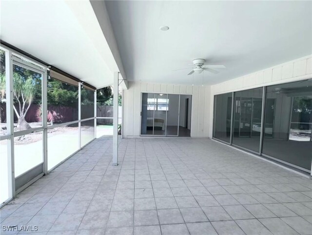 844 106th Ave N, Naples, FL 34108 - unfurnished sunroom with a ceiling fan