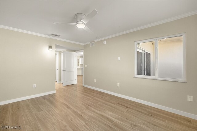 7400 Estero Blvd Unit 125, Fort Myers Beach, FL 33931 - unfurnished room with ceiling fan, ornamental molding, light wood-type flooring, and baseboards