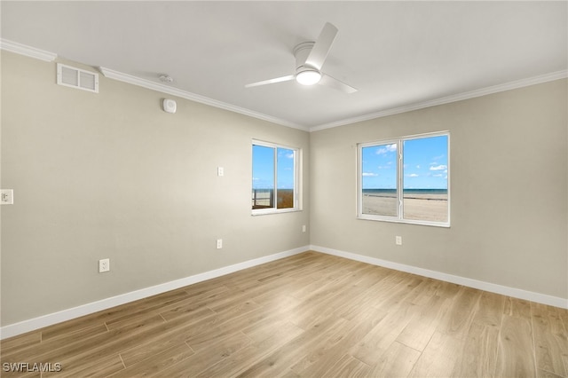 7400 Estero Blvd Unit 125, Fort Myers Beach, FL 33931 - unfurnished room featuring ceiling fan, light wood-style floors, ornamental molding, baseboards, and a smoke detector