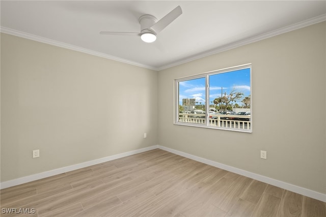 7400 Estero Blvd Unit 125, Fort Myers Beach, FL 33931 - unfurnished room featuring light wood finished floors, crown molding, ceiling fan, and baseboards