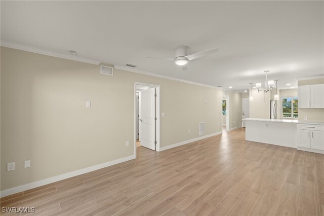 7400 Estero Blvd Unit 125, Fort Myers Beach, FL 33931 - unfurnished living room with light wood-style flooring, crown molding, baseboards, a chandelier, and recessed lighting