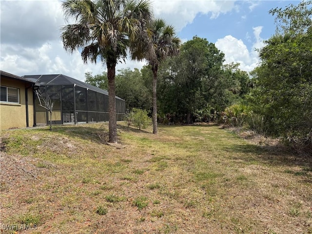 4335 18th Ave SE, Naples, FL 34117 - view of green lawn featuring glass enclosure