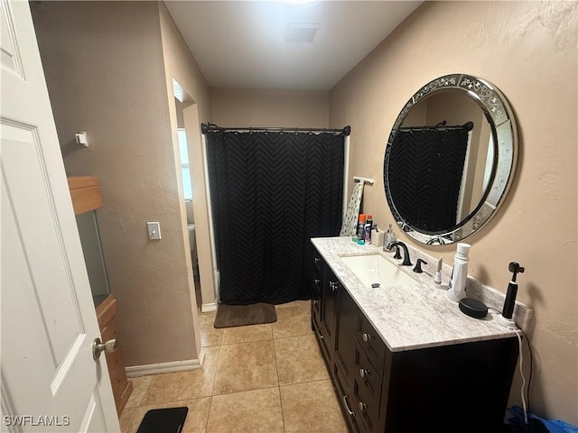 4335 18th Ave SE, Naples, FL 34117 - full bath with vanity, tile patterned floors, curtained shower, and baseboards