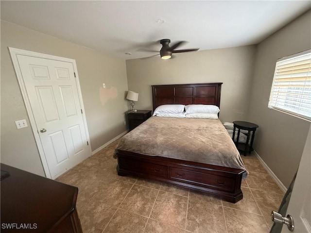 4335 18th Ave SE, Naples, FL 34117 - bedroom featuring tile patterned flooring, a ceiling fan, and baseboards