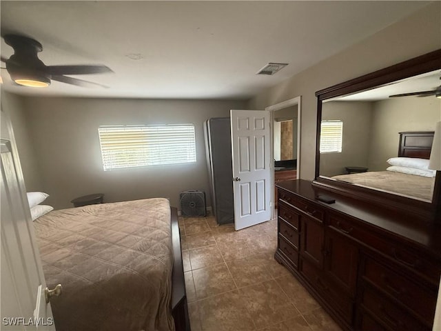 4335 18th Ave SE, Naples, FL 34117 - bedroom with dark tile patterned flooring and ceiling fan