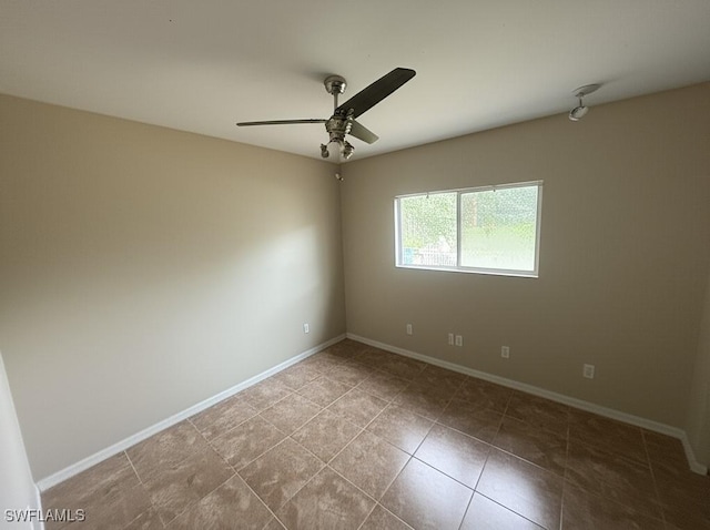 4335 18th Ave SE, Naples, FL 34117 - tiled empty room with ceiling fan and baseboards