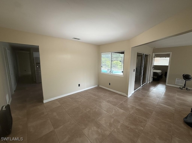 4335 18th Ave SE, Naples, FL 34117 - empty room featuring tile patterned flooring and baseboards