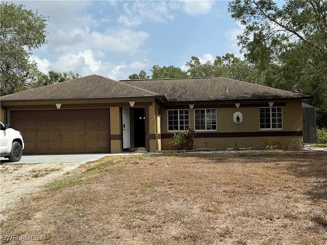 4335 18th Ave SE, Naples, FL 34117 - ranch-style home with stucco siding, an attached garage, concrete driveway, and roof with shingles
