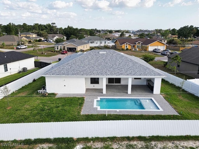 view of swimming pool with a residential view and a patio area