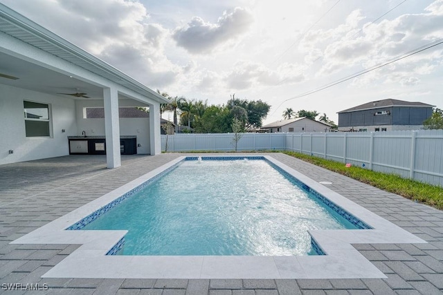 view of pool with a patio, a fenced backyard, and ceiling fan