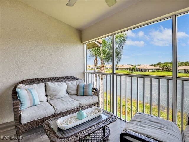 19920 Barletta Ln Unit 1423, Estero, FL 33928 - sunroom with a water view, a ceiling fan, and plenty of natural light