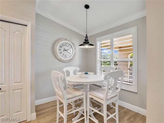 19920 Barletta Ln Unit 1423, Estero, FL 33928 - dining room featuring ornamental molding, baseboards, and light wood-style flooring