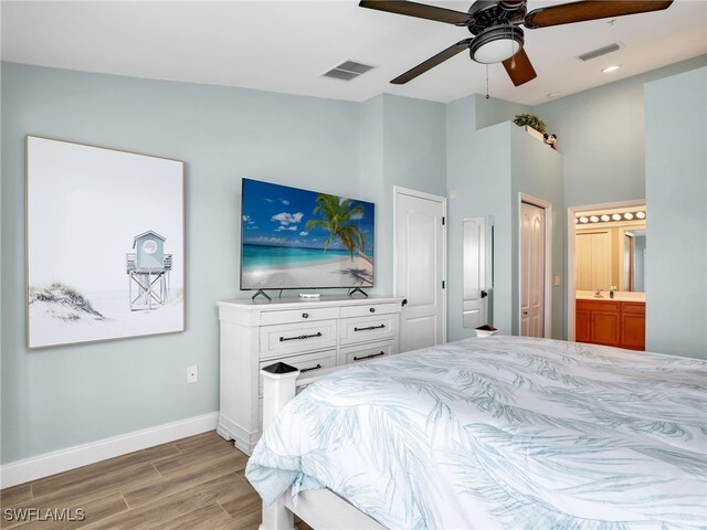 19920 Barletta Ln Unit 1423, Estero, FL 33928 - bedroom featuring wood finished floors, baseboards, ensuite bathroom, high vaulted ceiling, and a ceiling fan
