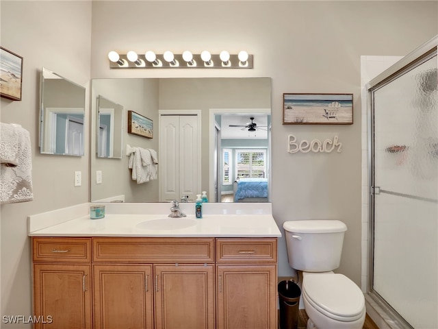 19920 Barletta Ln Unit 1423, Estero, FL 33928 - ensuite bathroom featuring a stall shower, toilet, a ceiling fan, and vanity