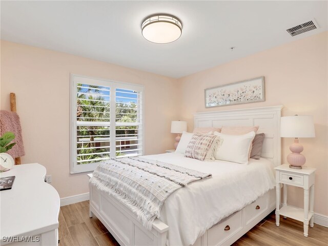 19920 Barletta Ln Unit 1423, Estero, FL 33928 - bedroom with baseboards and light wood-type flooring