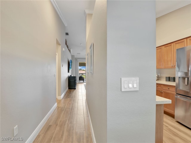 19920 Barletta Ln Unit 1423, Estero, FL 33928 - hall with light wood finished floors, baseboards, crown molding, and a high ceiling