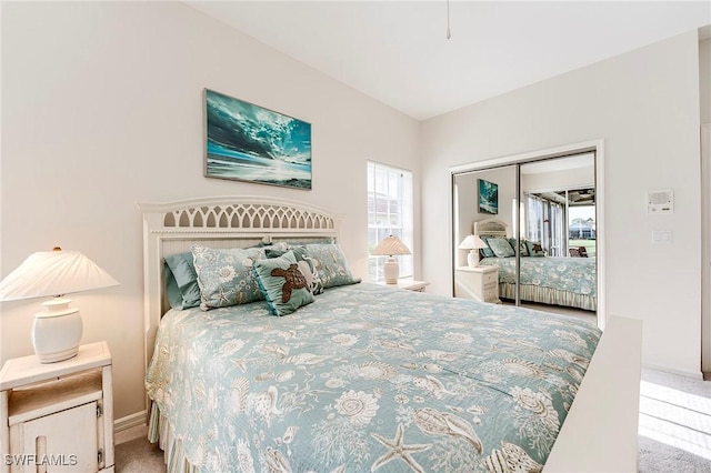 bedroom featuring carpet flooring and a closet