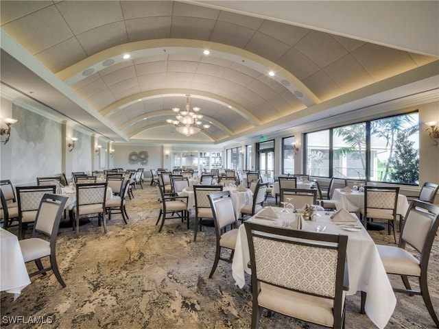 dining space with a chandelier, lofted ceiling, carpet flooring, and recessed lighting