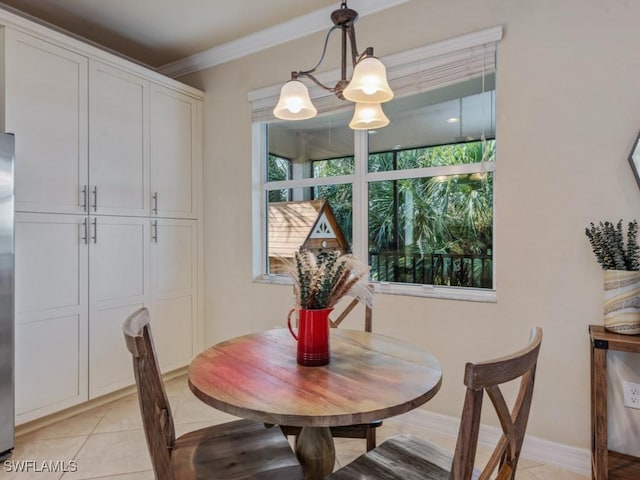 6536 Monterey Pt Unit 201, Naples, FL 34105 - dining room featuring light tile patterned floors, ornamental molding, and a chandelier