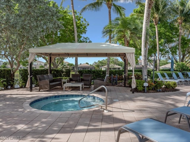6536 Monterey Pt Unit 201, Naples, FL 34105 - view of swimming pool with a patio area, a gazebo, and fence