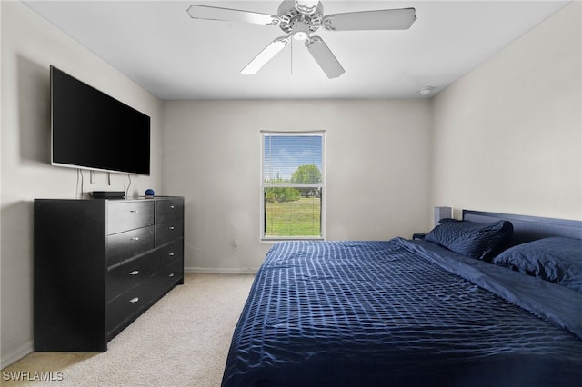 706 Kismet Pkwy E, Cape Coral, FL 33909 - bedroom featuring light carpet, baseboards, and a ceiling fan