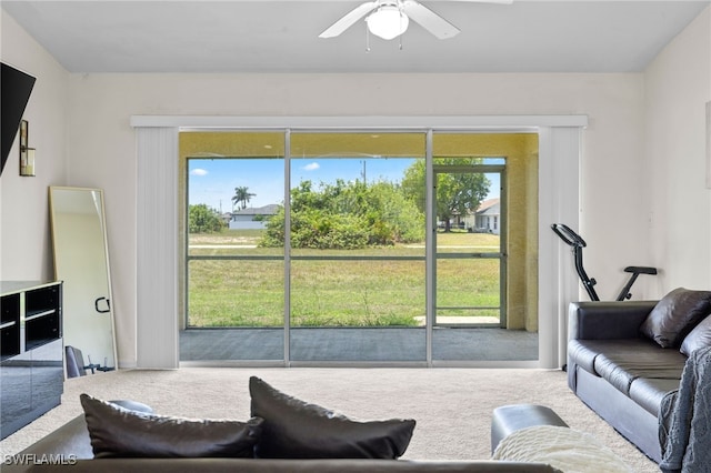706 Kismet Pkwy E, Cape Coral, FL 33909 - carpeted living area featuring a ceiling fan
