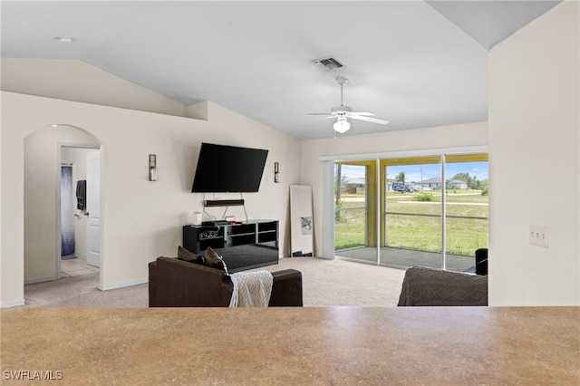 706 Kismet Pkwy E, Cape Coral, FL 33909 - living area with carpet, lofted ceiling, arched walkways, a ceiling fan, and baseboards