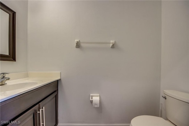 19530 Bowring Park Rd Unit 106, Fort Myers, FL 33967 - bathroom featuring toilet, vanity, and baseboards