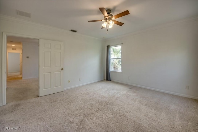 19530 Bowring Park Rd Unit 106, Fort Myers, FL 33967 - spare room featuring ornamental molding, ceiling fan, light carpet, and baseboards