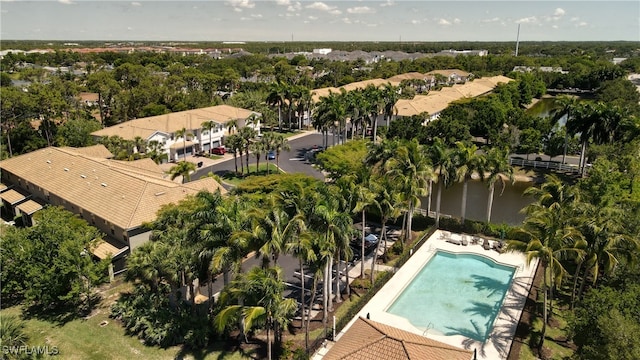 19530 Bowring Park Rd Unit 106, Fort Myers, FL 33967 - drone / aerial view of a nearby body of water, a pool area, and a tree filled landscape