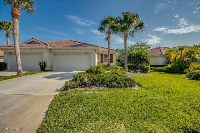 9373 Aviano Dr, Fort Myers, FL 33913 - mediterranean / spanish-style house featuring a tiled roof, an attached garage, stucco siding, a front yard, and driveway