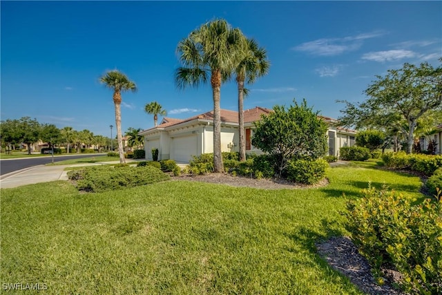 9373 Aviano Dr, Fort Myers, FL 33913 - view of front of property with a garage, a front lawn, and stucco siding