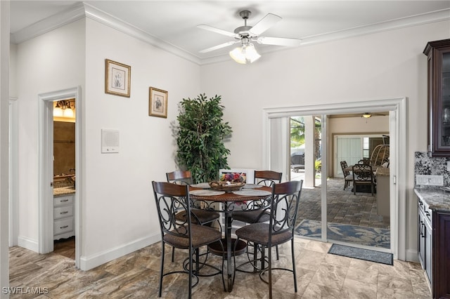 dining area featuring ceiling fan, ornamental molding, and baseboards