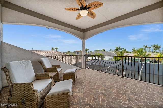 view of patio / terrace featuring a balcony and ceiling fan