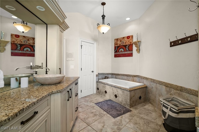 bathroom featuring a bath and vanity