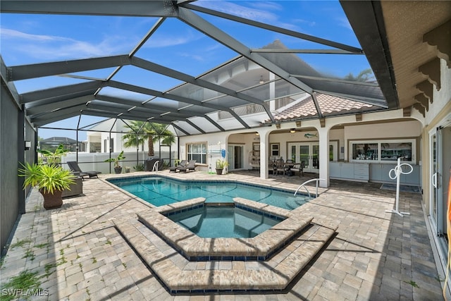 view of pool featuring a patio, french doors, a pool with connected hot tub, and ceiling fan