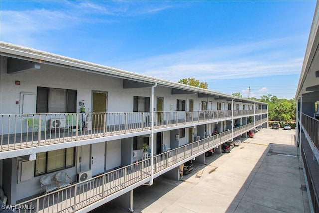 826 Wiggins Pass Rd Unit 306, Naples, FL 34110 - view of apartment building / complex with ac unit
