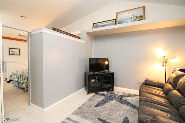 826 Wiggins Pass Rd Unit 306, Naples, FL 34110 - living area featuring light tile patterned flooring, lofted ceiling, and baseboards