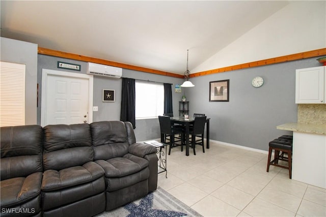826 Wiggins Pass Rd Unit 306, Naples, FL 34110 - living room with a wall mounted AC, vaulted ceiling, light tile patterned floors, and baseboards