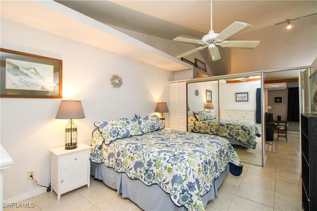 826 Wiggins Pass Rd Unit 306, Naples, FL 34110 - bedroom with light tile patterned floors and baseboards