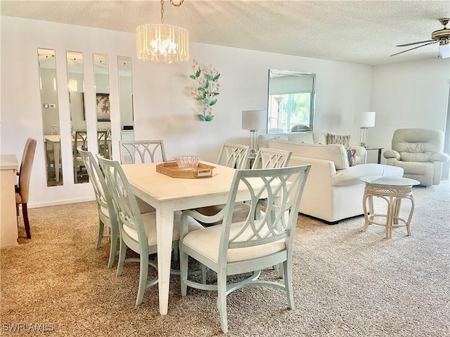 5985 Bloomfield Cir Unit D205, Naples, FL 34112 - dining space featuring light colored carpet, a textured ceiling, ceiling fan, and a chandelier
