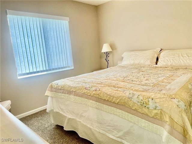 5985 Bloomfield Cir Unit D205, Naples, FL 34112 - bedroom featuring baseboards and carpet