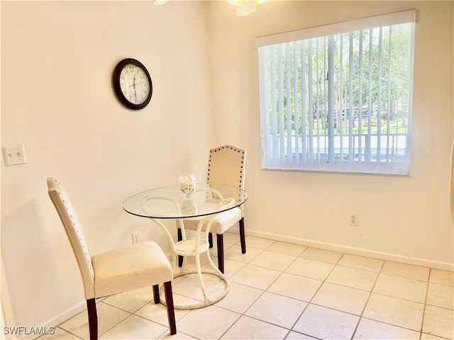 5985 Bloomfield Cir Unit D205, Naples, FL 34112 - dining space featuring plenty of natural light, baseboards, and tile patterned floors