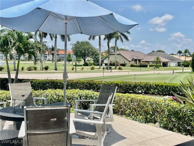 5985 Bloomfield Cir Unit D205, Naples, FL 34112 - view of patio / terrace with a residential view and view of golf course