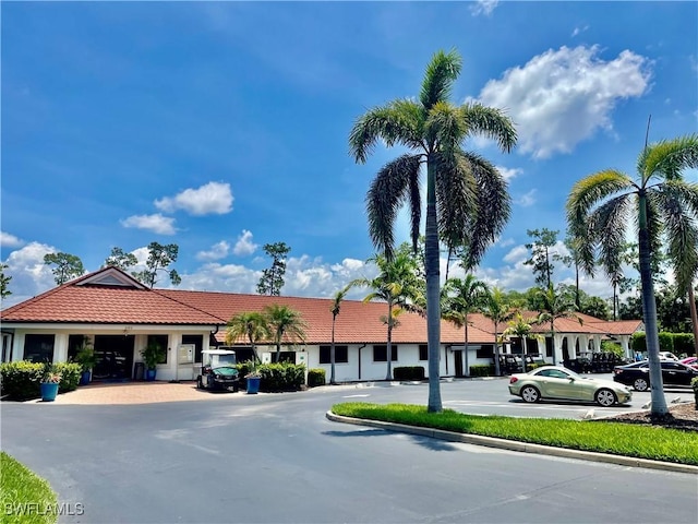 5985 Bloomfield Cir Unit D205, Naples, FL 34112 - view of property with uncovered parking