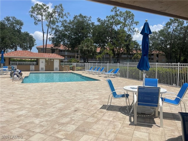 5985 Bloomfield Cir Unit D205, Naples, FL 34112 - community pool with a patio