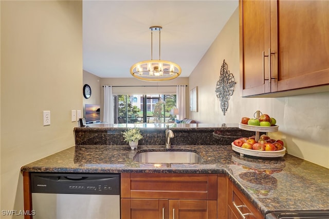 kitchen with dishwasher, a sink, brown cabinets, and dark stone counters
