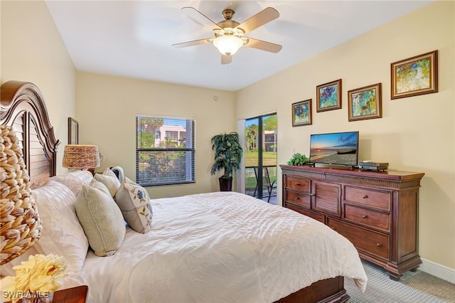 bedroom featuring access to outside, baseboards, ceiling fan, and carpet floors