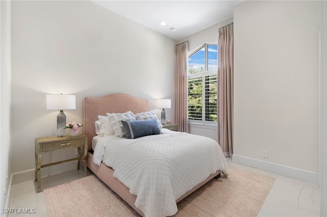 18492 Miromar Lakes Blvd W, Miromar Lakes, FL 33913 - bedroom with baseboards and light marble finish flooring